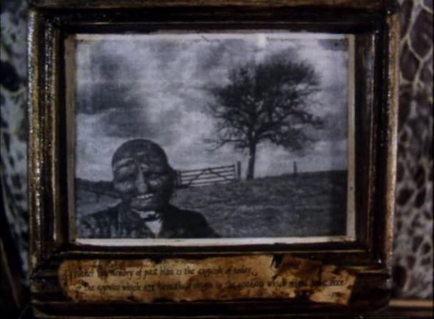The Man in the Lower-Left Hand Corner of the Photograph